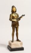 AN ART DECO GILT BRONZE AND BONE YOUNG MAN playing a mandolin, on an onyx base. 10.5ins high