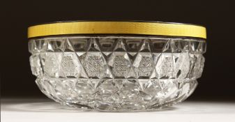 A CUT GLASS CIRCULAR BOWL with silver and yellow enamel rim 6ins diameter