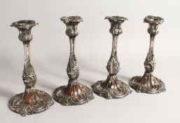 A SET OF FOUR 19TH CENTURY ROCOCO STYLE CANDLESTICKS 9INS LONG