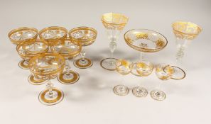 A GOOD SET OF SIX GILDED CHAMPAGNE GLASSES with ribbon motif and garlands along with three liqueur