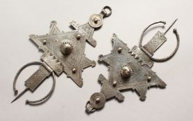 A SMALLER PAIR OF ISLAMIC SILVER HEAD PIECES