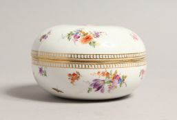A 20TH CENTURY MEISSEN CIRCULAR POT AND COVER sprigged with flowers. Cross swords mark in blue 4.