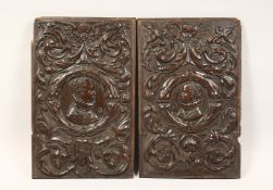 A GOOD PAIR OF ROMAN CARVED WOOD PANELS 19ins x 12ins.