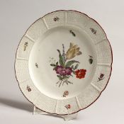 AN 18TH - 19TH CENTURY LUDSWIGBURG LATTICE PLATE white ground painted with flowers. 9ins diameter,