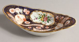 A BOAT SHAPED DISH, blue gilt ground 10ins long