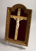 A GOOD ITALIAN CARVED IVORY CORPUS CHRISTI on a velvet background and gilt frame.
