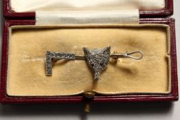 A GOLD AND DIAMOND FOX HUNTING PIN with fox's head