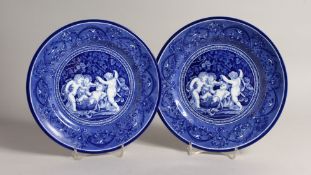 A PAIR OF BLUE AND WHITE CHERUB PLATES 10ins diameter
