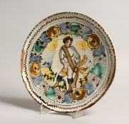 AN ITALIAN MAJOLICA PEDESTAL LOW TAZZA with cupid design. 8.5ins design