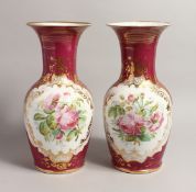 A GOOD PAIR OF LARGE 19TH CENTURY FRENCH PINK GROUND VASES with gilt decoration and painted with a
