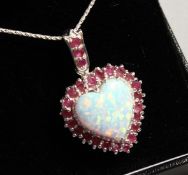 A SILVER RUBY AND OPAL HEART PENDANT on chain