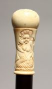 A NOVELTY WALKING STICK with carved bone handle, modelled as a mermaid 36ins high.
