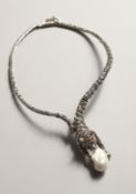 A SILVER AND MARCASITE PANTHER AND BAROQUE PEARL NECKLACE