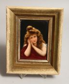 A GERMAN PORCELAIN MINIATURE OF A YOUNG LADY 5ins x 3.5ins in a gilt frame.