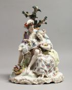 A LARGE 19TH CENTURY GERMAN PORCELAIN GROUP, boy and girl with a lamb, with encrusted with flowers