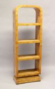 AN ART DECO STYLE BURR WOOD FREE STANDING OPEN BOOKSHELF, with four shelves on a platform base.