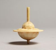 A CARVED BONE SPINNING TOP 2ins