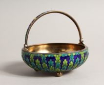 A 19TH CENTURY RUSSIAN SILVER AND ENAMEL CIRCULAR BASKET with swing handles on three ball feet
