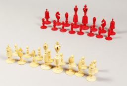 A RED & WHITE IVORY CHESS SET in an oak box along with a letter which states it belonged to the