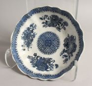 A BLUE AND WHITE SHAPED CIRCULAR DISH 9.5ins diameter Blue star mark.