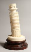 AN ALABASTER GROUP OF THE LEANING TOWER OF PISA , on a wooden base 13ins high.