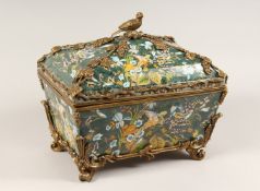 A LARGE, DECORATIVE PORCELAIN AND ORMOLU MOUNTED CASKET AND COVER 14.5ins long.