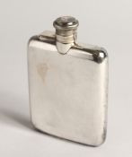 A SILVER HIP FLASK with hinged, captive top Sheffield 1941 5ozs, 5ins high.