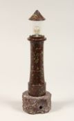 A CORNISH SERPENTINE MARBLE LIGHTHOUSE 10ins high.
