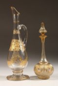 A GOOD GILDED SLENDER JUG engraved in gilt with flowers, 7ins high and a small bottle vase 6ins