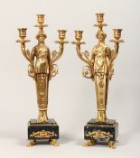 A PAIR OF GILT, BRONZE AND MARBLE THREE LIGHT FIGURAL CANDELABRAS, in the manner of Thomas Hope.