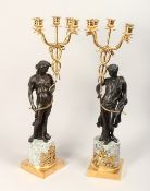 AN IMPRESSIVE PAIR OF CLASSICAL BRONZE, GILT BRONZE AND MARBLE FIVE LIGHT CANDELABRA, modelled as