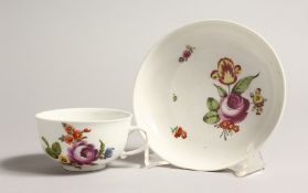 A 19TH CENTURY VIENNA COFFEE CUP AND SAUCER painted with flowers. Mark in blue