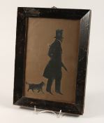 A VICTORIAN FRAMED AND GLAZED SILHOUETTE OF A GENTLEMAN, with his dog. 10ins x6.5ins