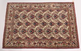 A GOOD PERSIAN KAHAN CARPET, cream ground with vases of flowers. 6ft 7ins x 4ft 5ins