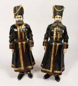 A LARGE PAIR OF COLD PAINTED BRONZE FIGURES OF RUSSIAN COSSACKS. 1ft 4ins high