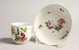 A 19TH CENTURY VIENNA COFFEE CUP AND SAUCER painted with flowers. Mark in blue