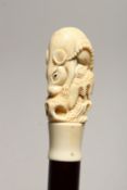 A NOVELTY WALKING STICK, with carved bone handle modelled as a rat. 36ins high.
