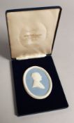A WEDGWOOD BLUE AND WHITE OVAL PLAQUE 