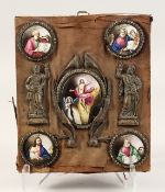 FIVE VARIOUS ENAMEL RELIGIOUS PORTRAITS with metal figures in a wooden tablet 12ins x 10ins