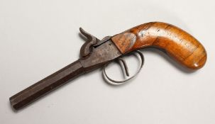 A PERCUSSION CAP PISTOL WITH WOODEN HANDLE. 7.5ins long