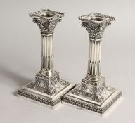 A PAIR OF CLASSICAL SILVER CANDLESTICKS Sheffield 1902 Maker James Dixon & sons.