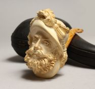 A 19TH CENTURY MEERSCHAUM PIPE as the head of a bearded man, in a leather, case.