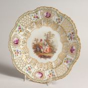 A 19TH CENTURY MEISSEN CIRCULAR PLATE with vignettes of flowers and buildings, the centre with young