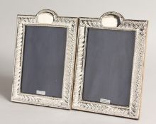 A PAIR OF SILVER WRYTHEN UPRIGHT PHOTOGRAPH FRAMES 8.5ins x 5.5ins