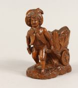 A GOOD SMALL BLACK FOREST CARVED WOOD BOY pulling a cart 5ins
