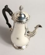 A SILVER COFFEE POT, with reeded finial, gadrooned rim and foot rim. London 1887 14ozs 8.5ins high