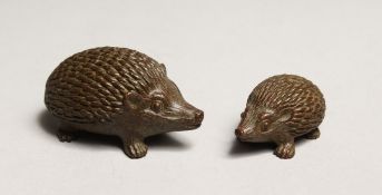 A PAIR OF JAPANESE BRONZE HEDGEHOGS