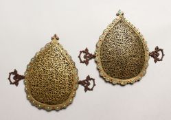 A PAIR OF 19TH CENTURY ISLAMIC GILT METAL OPENWORK CALLIGRAPHIC PANELS, inlaid with turquoise and