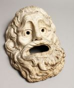 AN INTERESTING CARVED MARBLE ROMAN HEAD with open mouth and eyes and curly hair. 13ins long