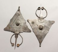 A PAIR OF ISLAMIC SILVER HEAD PIECES